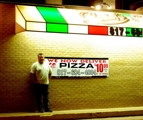 Steve of Lushaj's Pizza and Pasta Outside his Pizzeria (prices may vary from the sign. The best pizza in Euless.