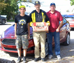 Post Commander Charlie Peoples (center), my son Ezekiel (left) and me, Brian of PizzaSpotz (right)